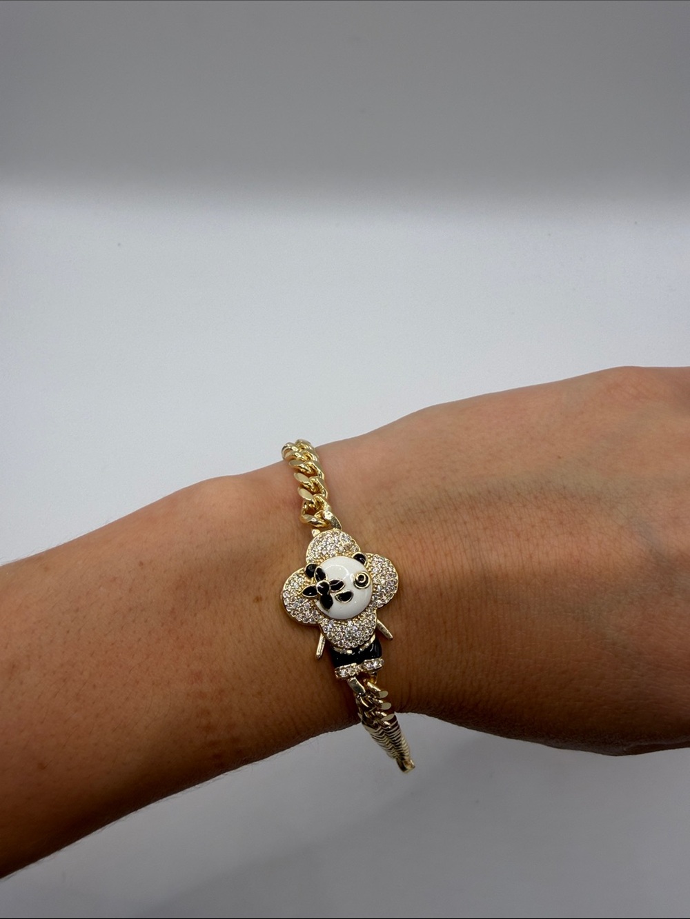 1409. Gold Tone Vivi Crystal Charm Bracelet with Black and White Enamel. 6.5”